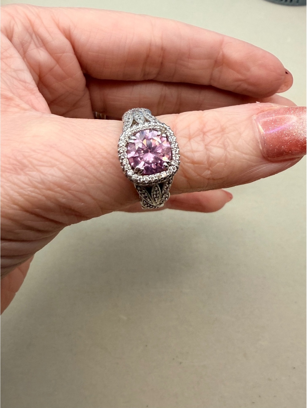 Silver tone pink round halo ring
